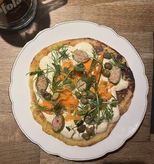 topped rösti with cashew "cheese" and carrot "lox"  at Střecha in Prague