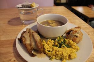 Excellent onion soup, puff pastry with, I guess, beans, scrambled tofu with turmeric, roasted potatoes with garlic gravy, and a small piece of chocolate with lupin, black tea. at Střecha in Prague