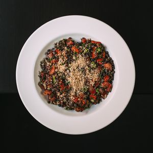 Black lentil salad with fresh and sundried tomatoes and nut parmasan at Střecha in Prague