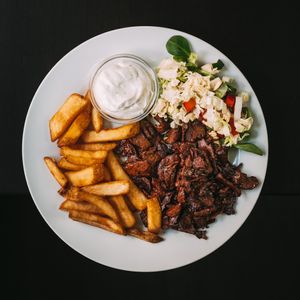 Kebab plate with fries and garlic dip at Střecha in Prague
