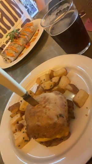 Breakfast sandwich with upgrade to biscuit, cold brew, and burrito in the back. at The Dankness Dojo by Modern Times Beer in Los Angeles