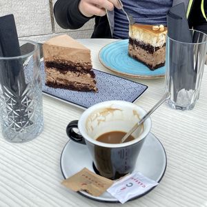 Snickers and chocolate cake + coffee with rice mylk at Cajnica Vanilla in Koper