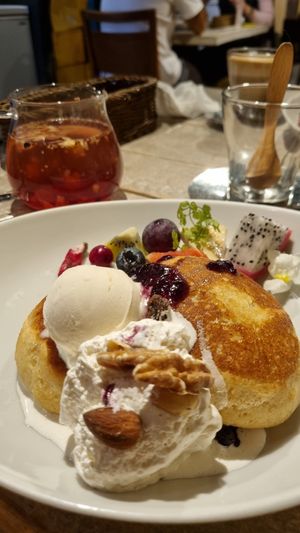 Fruit pancakes, with scoop of vanilla ice cream, whipped cream, fruit and fruit tea infusion at AIN SOPH.Journey in Kyoto