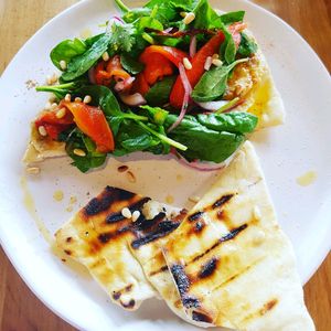 The Med. Grilled flatbread, hummus, chargrilled aubergine, red capsicum salad, hemp oil and toasted pine nuts. at The Butcher's Son in Auckland