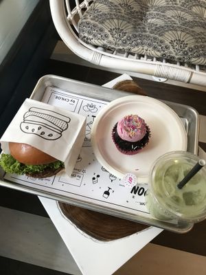 Burger, gluten free cupcake and iced matcha latte at By Chloe - Covent Garden in London