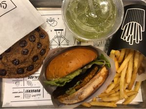 Guac burger, fries, giant cookie and basil lemonade  at By Chloe - Covent Garden in London