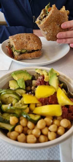Vegan salad bowl and vegan sandwich at Escosazio in Rome