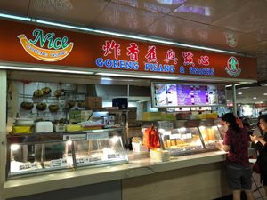Exterior of the shop. Customers can choose to take the fritters yourself or have them assist you. at Nice Goreng Pisang & Snack Stall in Central Singapore