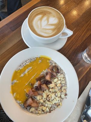 Overnight oats with pears, mango coulis & toasted almonds! Lavender Fields Latte. Beautifully crafted and delicious.  #Veganuary at SEA - Floret in Seattle