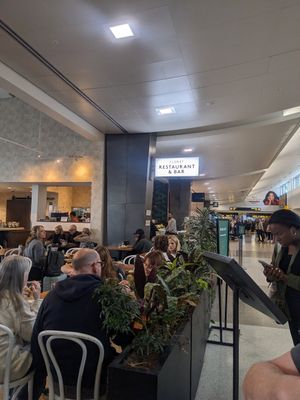 Walkway sign for easy finding at SEA - Floret in Seattle