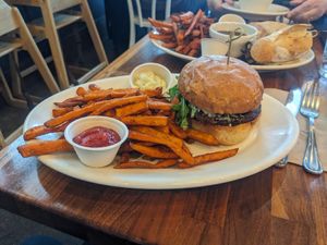 Black bean burger $20 comes with "yam fries" sweet potato at SEA - Floret in Seattle