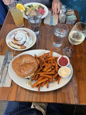Spicy crispy tofu sandwich with yam fries, wine, cinnamon roll. YUMMMMM  at SEA - Floret in Seattle