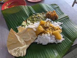 Rice dish served on a banana leave (later got some tofu and fried mashrooms) at Selvam in Malacca