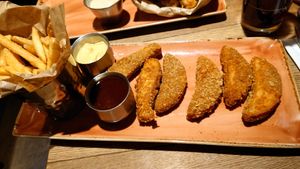 Chicken wings and fries, the sauces are delicious! at Hard Rock Cafe in Innsbruck