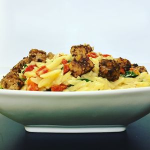 Italian Orzo with Tempeh Sausage
Delicious, satisfying, simple hearty pasta dish. Orzo pasta, sun dried tomatoes, and spinach tossed in garlic broth sauce, topped with tempeh sausage crumbles makes quick healthy dinner. at Chip and Kale in Pittsburgh