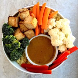 Tofu Peanut Satay Bowl: 
Vibrant, simple and delicious bowl of hot, fluffy rice topped with roasted vegetables, crispy baked tofu. at Chip and Kale in Pittsburgh