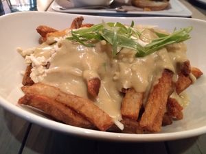 "Teem Poutine" was divine. Huge portions so you could definitely split it  at MeeT in Yaletown in Vancouver