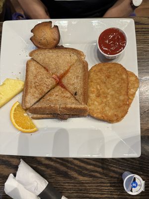 Vegan Grilled Cheese with hash brown, fruit and vegan muffin    at Hometown Sports Grill in Ottawa
