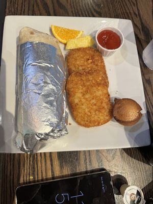 Vegan Breakfast Tofu Western Wrap with hash brown, fruit and vegan muffin   at Hometown Sports Grill in Ottawa