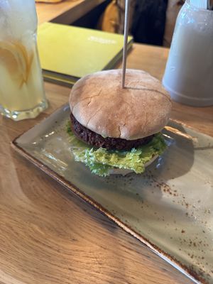 Erbsenkönigin Burger and orange lemon lemonadee  at Hans Im Glück in Berlin