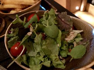 salad on the side at Hans Im Glück in Berlin