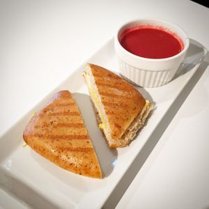 Grilled Cheese Panini with side of beet soup. at Gratify Foods in Penticton