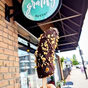 Frozen Banana with Crushed Peanuts at Gratify Foods in Penticton