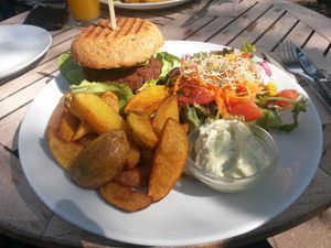 vegan falafel burger with potato wedges, salad and vegan mayo at Cafe Affenbrot in Luebeck