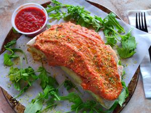 Vegan cheesy breadsticks which have cashew mozzarella spread with marinara on top at Fine Folk Pizza in Fort Myers