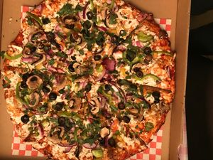 Veggie goddess pizza with vegan cheese  at The Curry Pizza Company - Shaw Ave in Fresno