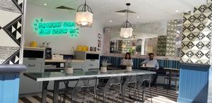 inside seating at By Chloe - Tower Bridge in London