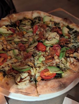 Vegan pizza with artichokes, chickpeas, avocado and balsamic glaze at Village Pantry in Hamilton