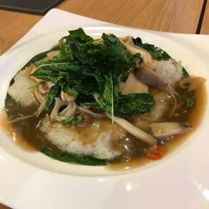 Rice vermicelli in spicy Thai basil with mixed mushroom at Food Universe in Bangkok