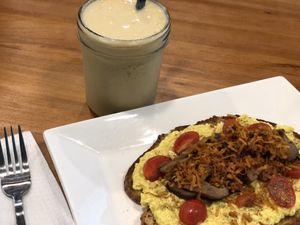 Tofu and sautéed mushroom on sourdough with Mango,banana and orange and soymilk at Soul ALife - Changi City Point in East Singapore