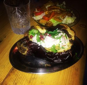 Whole roasted aubergine with tahiny and pomegranate. Vegan at Shouk in Drumcondra