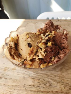 Rum and raisin plus chocolate fudge truffle ice cream topped with chopped walnuts  at Revival in Whitstable