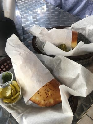 Pocket with pickles and spicy sauce on the side  at Frena Bakery and Café - Soma in San Francisco