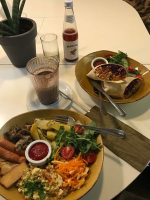 Lemonade, hot cocoa, full English breakfast and burrito. 👀💚 (September 2019)  at Mazā Terapija in Riga