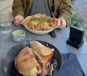 Crispy tofu burger (I cut it in half before the photo) and jackfruit nachos at Mazā Terapija in Riga
