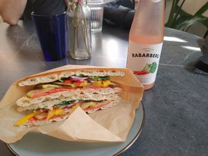 Sandwich and sparkling water at Mazā Terapija in Riga