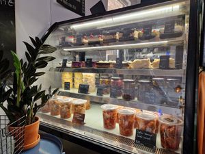 Selection of cake and other goods. at Mazā Terapija in Riga