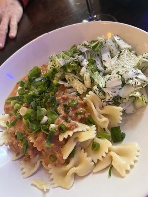 Pasta with tomato-Soy-Sauce and side salad 🥗   at Mazā Terapija in Riga