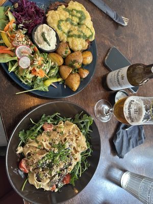Chicken parma with potatoes and cream & truffle pasta  at Mazā Terapija in Riga