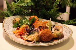 Dinner menu dish - Smoked croquettes in BBQ sauce with rosemary potatoes at Mazā Terapija in Riga