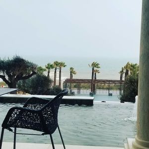 view from the window seating area inside on a stormy winter day in Tunis at Azur - Four Seasons Hotel in Tunis