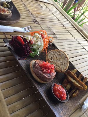 spicy burger with fries at Nourish Restaurant in 