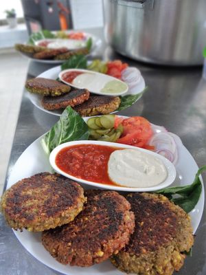 Protein Portion
Three burgers of your choice (falafel, veggie, soy), sauces of your choice (cashew sour cream, sunflower mayo, tahini, hot tomato sauce) served with fresh vegetables (Swiss chard, tomatoes, red onions) and pickles.

The meal satisfies approximately 90% of protein and 70% of iron RDA. at Vegan 365 Kitchen in Skopje