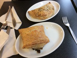 The very nice steak and mushroom pastry in the front and the ok cheese and onion pastry behind at Coughlans Bakery - High St in Croydon