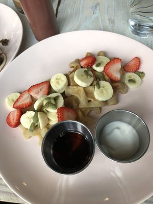 Weekend waffles with syrup and coconut creme  at Tribal All Day Cafe in Dallas