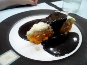 Coconut and carrot cake served with a chocolate sauce. at Garibolo in Bilbao